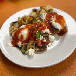 Pier View Restaurant - The "Aria". Veggie & Feta Benny with homemade Creole Sauce.