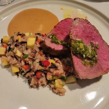 V. Mertz - NY strip with wild rice, bourbon sauce was amazing! - New American Near Me - Omaha, Nebraska V. Mertz - NY strip with wild rice, bourbon sauce was amazing! - New American Near Me - Omaha, Nebraska