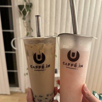 CAFFE:iN - Left: Milk Tea with brown crystal boba (agar) 25% ice, regular sugar ($4.95 + price of topping). Right: white peach smoothie ($5.95). - Coffee & Tea Near Me - Union City, California