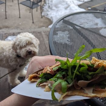 Coco - The prosciutto/fig Jam/gorgonzola crepe, delicious!! and an envious puppy - French Near Me - Buffalo, New York