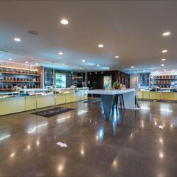 Tokyo Starfish South Bend Cannabis Dispensary - TOKYO STARFISH Southern Bend, Oregon main interior looking at interior counters and flower wall displays.