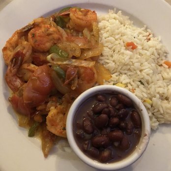 El Apretador - a plate of food with rice and beans - Seafood Near Me - Bay Shore, New York
