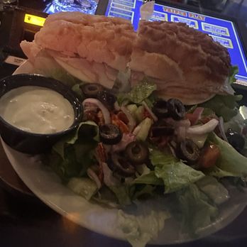Flowing Tide Pub 3 - Not sure what they called it but it was a turkey sandwich on a Dutch crunch roll it was absolutely delicious and the salad was so yummy - Sports Bars Near Me - Reno, Nevada