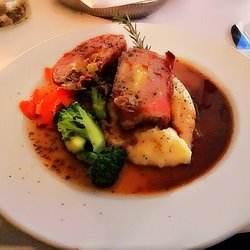 The Gates on Roblin - Pork tenderloin with mushroom, brie, apples, walnuts, served with whipped garlic potatoes, calvados thyme jus at The Gates on Roblin