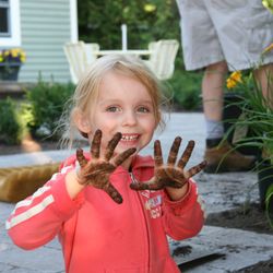 LawnSavers Plant Health Care Experts - Future LawnSaver Reese learning by getting dirt on her hands!