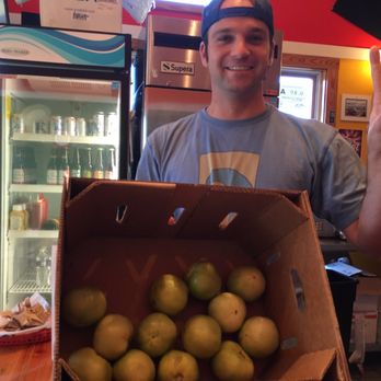 Mama Easley's - Owner with box of green tomatoes for frying! - Seafood Near Me - Corolla, North Carolina