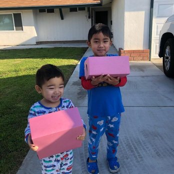 Grand Donuts No 2 - two children holding boxes - Donuts Near Me - Whittier, California
