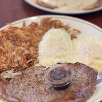 Popular Cafe - Ribeye steak medium rare, crispy hashbrowns, and over easy eggs - American Near Me - Montclair, California