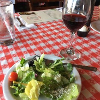 Del's Pizzeria - Dinner salad split between two plates and a glass of Chianti. - Pizza Near Me - Pismo Beach, California