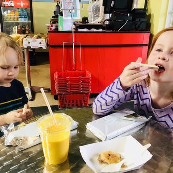 Mint masala Groceries - two children eating donuts - International Grocery Near Me - Omaha, Nebraska Mint masala Groceries - two children eating donuts - International Grocery Near Me - Omaha, Nebraska
