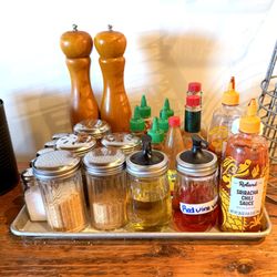 Buffalo State Pizza - Condiments - Crushed Red Peppers and Parmesan Cheese Also Available at the Tables
