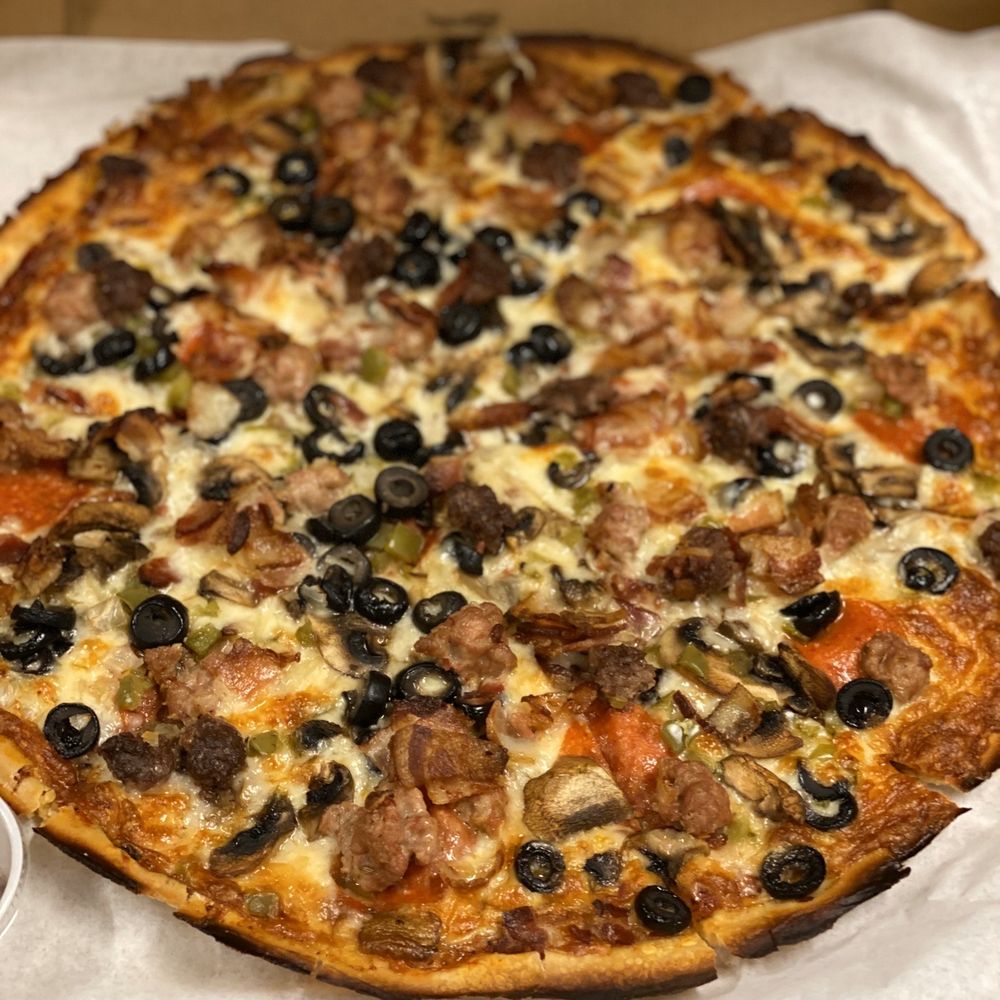 The Cloverleaf - Monster Pizza with anchovies on the side. Size- Huge - Pizza Near Me - Tacoma, Washington The Cloverleaf - Monster Pizza with anchovies on the side. Size- Huge - Pizza Near Me - Tacoma, Washington