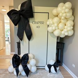 AZA Balloon Decor - Custom backdrop with custom bows and organic styled balloons