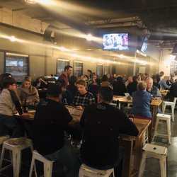 Bosque Brewing - Telshor Public House - Main seating area. Large communal tables, booths around edge. Great to watch the game or grab a bite with the family.