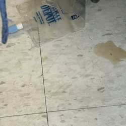 RiverPointe Post Acute - Drain bag on filthy floor leaking bacterial resistant e. Coli, from not being changed. Nurse walked through the infected pus/blood.