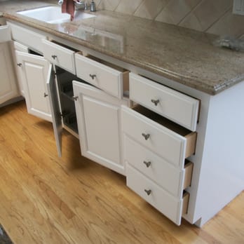 Marlon's Painting - a kitchen with white cabinets and marble counter tops - General Contractors Near Me - Escondido, California Marlon's Painting - a kitchen with white cabinets and marble counter tops - General Contractors Near Me - Escondido, California
