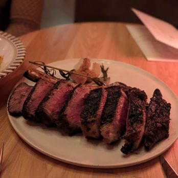 Prime Bar - Chicago - Nisos Prime Signature Cut: Wood Grilled 22 oz Bone-in Ribeye - Cocktail Bars Near Me - Chicago, Illinois