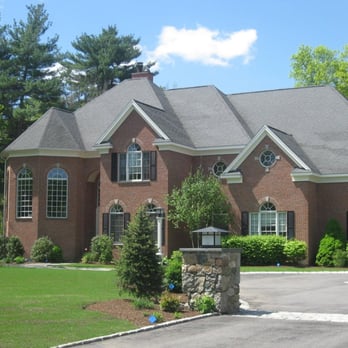 Brolly Construction - the front of a brick house - General Contractors Near Me