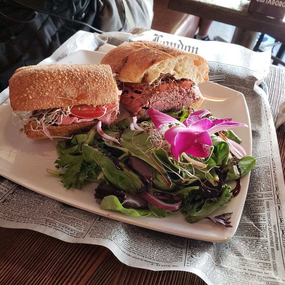 Nomad Cafe & Eatery - The First Class. Crunchy baguette, perfectly cooked roast beef, fresh mozz, tomatoes, sprouts and truffle balsamic reduction. - Cafes Near Me - Ridgewood, New York Nomad Cafe & Eatery - The First Class. Crunchy baguette, perfectly cooked roast beef, fresh mozz, tomatoes, sprouts and truffle balsamic reduction. - Cafes Near Me - Ridgewood, New York