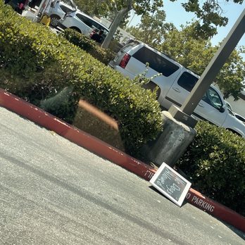 Gilroy Farmers Market - a sign on the corner of a street - Farmers Market Near Me - Gilroy, California