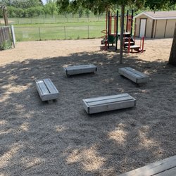 Southern Sask Construction - Full pea rock install throughout play area including weed barrier. No more scrapes from the old crusher dust at this daycare!