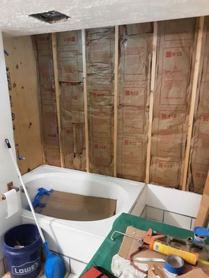 Basement bathroom remodeling and window fill-in - THis was a bathroom in the basement that had a window covered up with drywall. I opened up the wall, took out the window and frame and drilled holes for rebar. I filled in the window with foundation concrete and sealed it with tar sealer. I then replaced the shower diverter and walls with new wood and insulation. Third stage was rockcrete and greenboard drywall. final stage was tile installation. I am very proud of this project and it cost her less than $3,500 for the total duration of this job. Basement bathroom remodeling and window fill-in - THis was a bathroom in the basement that had a window covered up with drywall. I opened up the wall, took out the window and frame and drilled holes for rebar. I filled in the window with foundation concrete and sealed it with tar sealer. I then replaced the shower diverter and walls with new wood and insulation. Third stage was rockcrete and greenboard drywall. final stage was tile installation. I am very proud of this project and it cost her less than $3,500 for the total duration of this job.