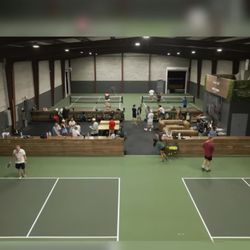 Dink House Pickleball - View of courts and common area.