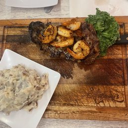 Steak and shrimp with mashed potatoes
