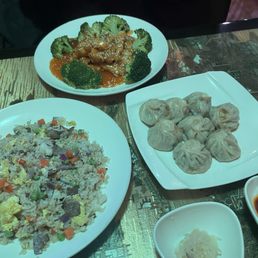 Pork momos, sesame chicken, and beef fried rice Pork momos, sesame chicken, and beef fried rice