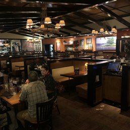 people sitting at tables in a restaurant people sitting at tables in a restaurant