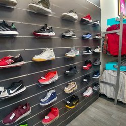 Plato's Closet - Mens shoes were impressively displayed.