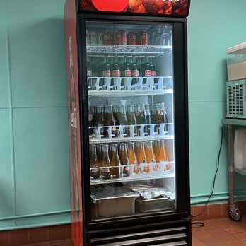 Milpas Taqueria - a soda cooler in a kitchen - Mexican Near Me - Santa Barbara, California Milpas Taqueria - a soda cooler in a kitchen - Mexican Near Me - Santa Barbara, California