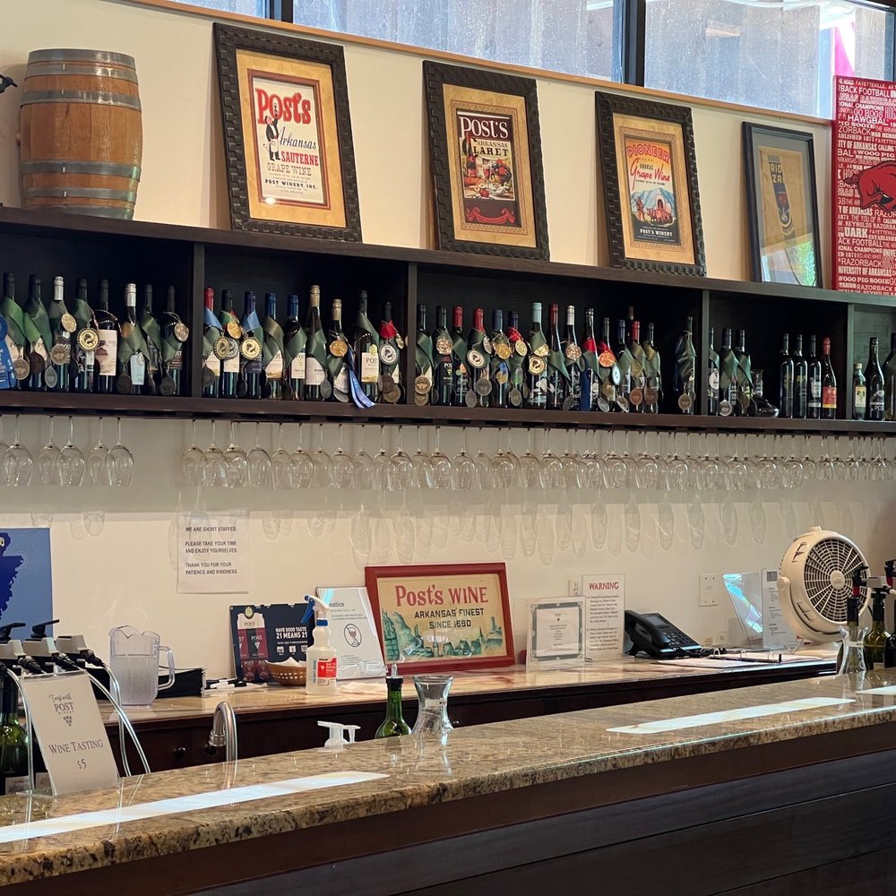 a row of wine glasses on a bar a row of wine glasses on a bar