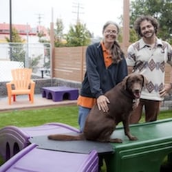Bark Boulevard - The owners - mother, son, and chocolate lab Charli Brown in the canine playground!