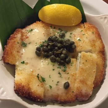 Buzz's - Best. Calamari. Ever.  Crispy on outside with lite panko crumbs, fish melts in your mouth. Lemon and capers add perfect touch.  Sooooo good. - Steakhouses Near Me - Kailua, Hawaii