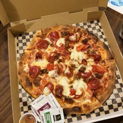 Honey Bee Pizzeria and Grinders - Build your own pizza: Pepperoni, sausage, roasted red peppers, and onions.