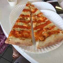 two slices of pizza on a paper plate