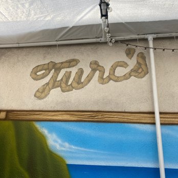 Turcs - the word turcs painted on the side of a building - Dive Bars Near Me - Sunset Beach, California