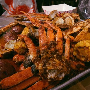 Crazy Crab - 2lbs of snow crab legs, 1lb of manila clams, 1lb of headless shrimp with sausages, corn & potatoes in a mix of cajun sauce + garlic butter - Cajun/Creole Near Me - Fairfax, Virginia Crazy Crab - 2lbs of snow crab legs, 1lb of manila clams, 1lb of headless shrimp with sausages, corn & potatoes in a mix of cajun sauce + garlic butter - Cajun/Creole Near Me - Fairfax, Virginia