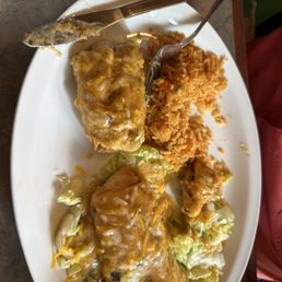 Crispy Chili Rellanos came with rice and charro beans Crispy Chili Rellanos came with rice and charro beans