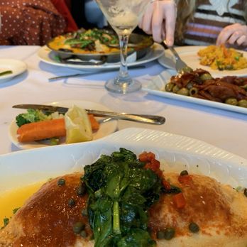 Ibiza Mediterranean Restaurant - Branzino stuffed with crab and vegetable paella. - Seafood Near Me - Avon Lake, Ohio Ibiza Mediterranean Restaurant - Branzino stuffed with crab and vegetable paella. - Seafood Near Me - Avon Lake, Ohio