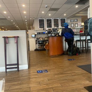 Eggsperience Cafe - a man sitting at a counter - Breakfast & Brunch Near Me - Chicago, Illinois