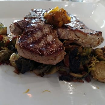 Pensive Distilling - Pork chop with Brussels sprouts - Cocktail Bars Near Me - Newport, Kentucky Pensive Distilling - Pork chop with Brussels sprouts - Cocktail Bars Near Me - Newport, Kentucky