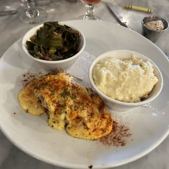 Vic's River Grill - Grilled Salmon Oscar with grits and collards. - New American Near Me - Savannah, Georgia