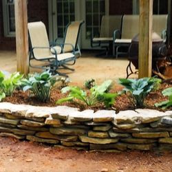 Solomon's Landscape & Design - Stacked stone wall and plantings in Simpsonville, SC
