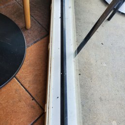 a glass door with a broken handle a glass door with a broken handle