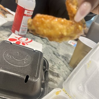 J Burger N Wings - a hand holding a piece of fried chicken - Fast Food Near Me - LaGrange, Georgia J Burger N Wings - a hand holding a piece of fried chicken - Fast Food Near Me - LaGrange, Georgia