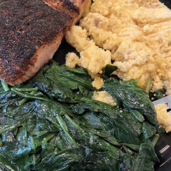 Fishbones - Blackened Wild Salmon Filet with grits and spinach - New American Near Me - Greensboro, North Carolina