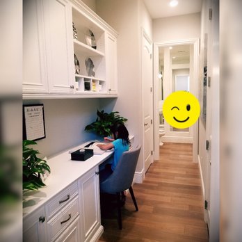 Nguyen Brothers - a woman sitting at a desk with a smiley face drawn on it - Tiling Near Me Nguyen Brothers - a woman sitting at a desk with a smiley face drawn on it - Tiling Near Me