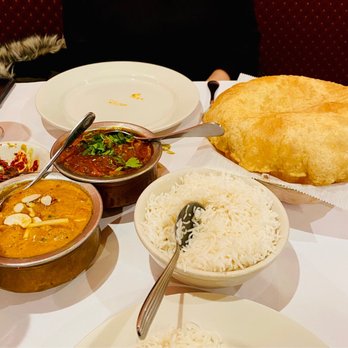 Raagini - a variety of indian food on a table - Indian Near Me - Baldwin, New York